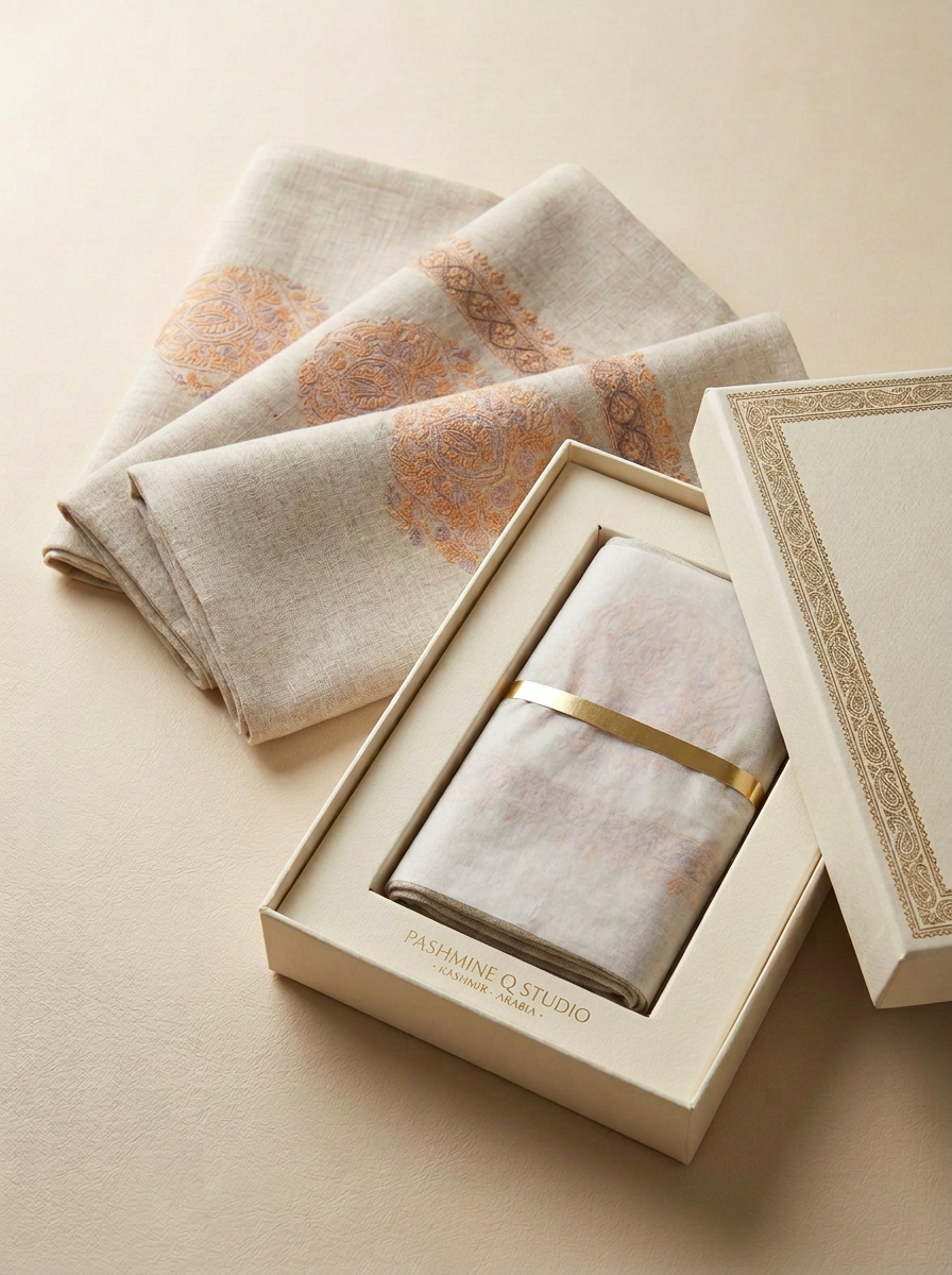 Linen-toned pashmina folded gutra with saffron paisley embroidery